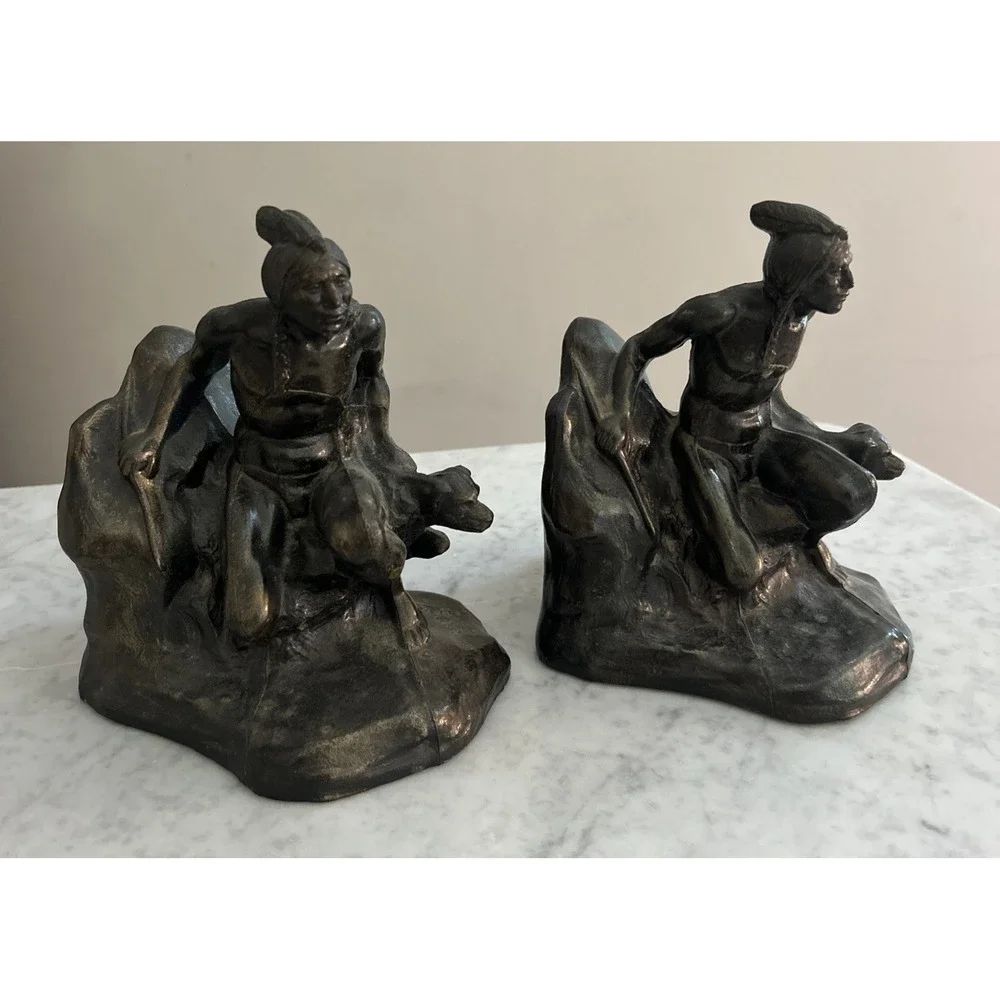 Antique Meal metal cast Indian bookends. Good condition.